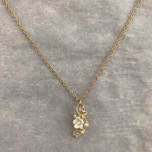 Dainty handmade gold flower necklace with rhinestone details